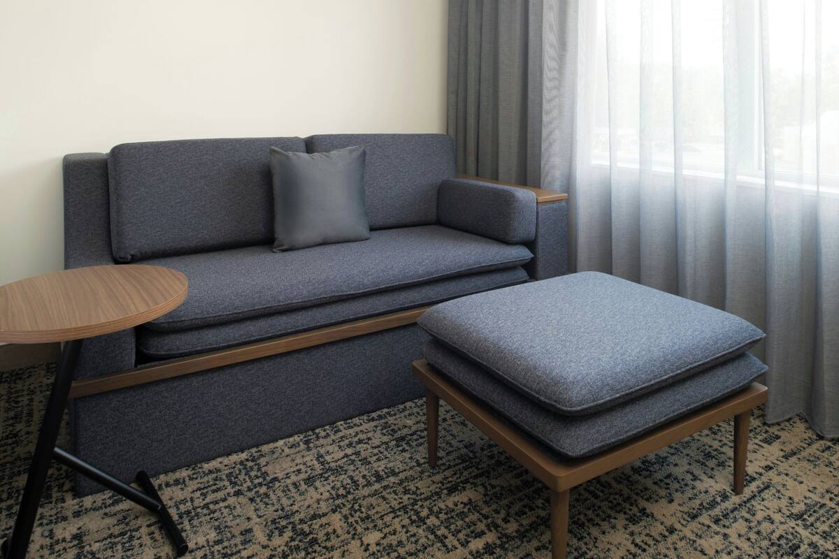 Premium bedding, desk, laptop workspace, iron/ironing board