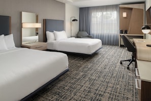 Premium bedding, desk, laptop workspace, iron/ironing board