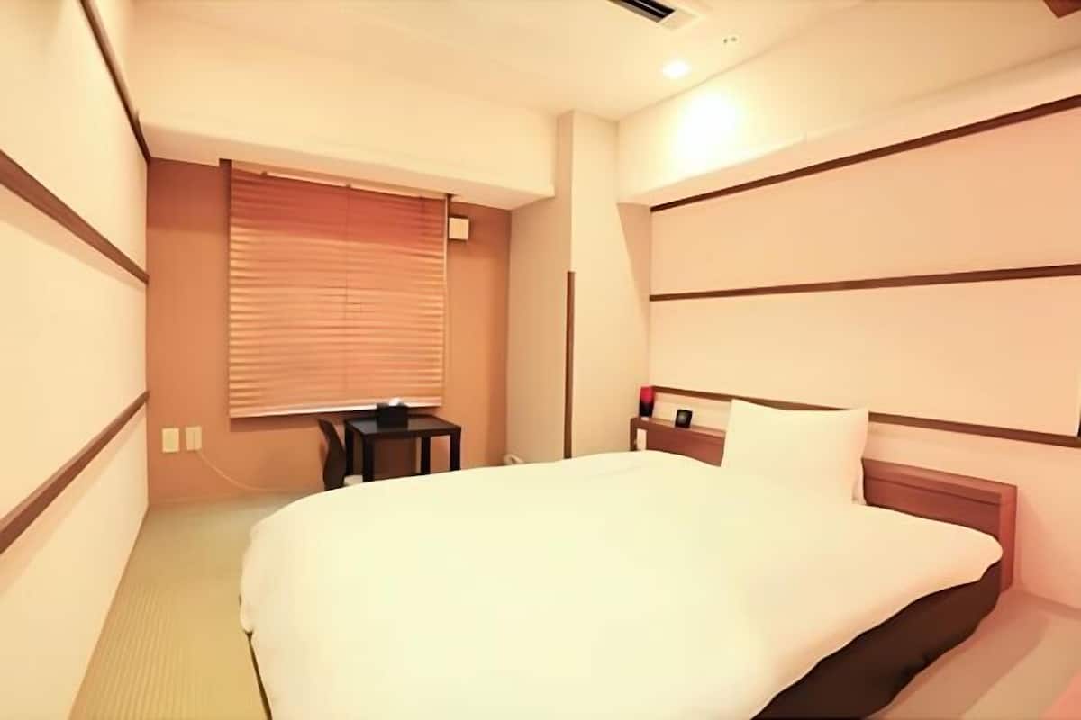 Desk, blackout curtains, free WiFi, bed sheets