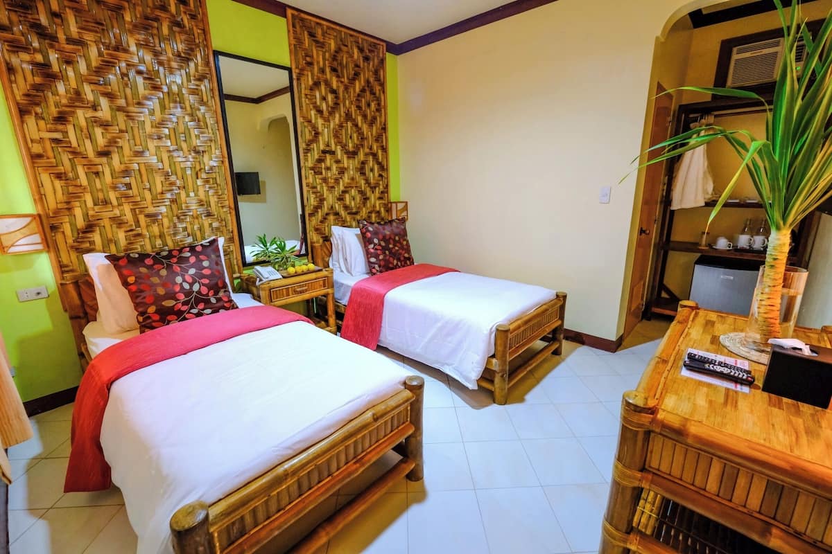 Minibar, desk, laptop workspace, bed sheets
