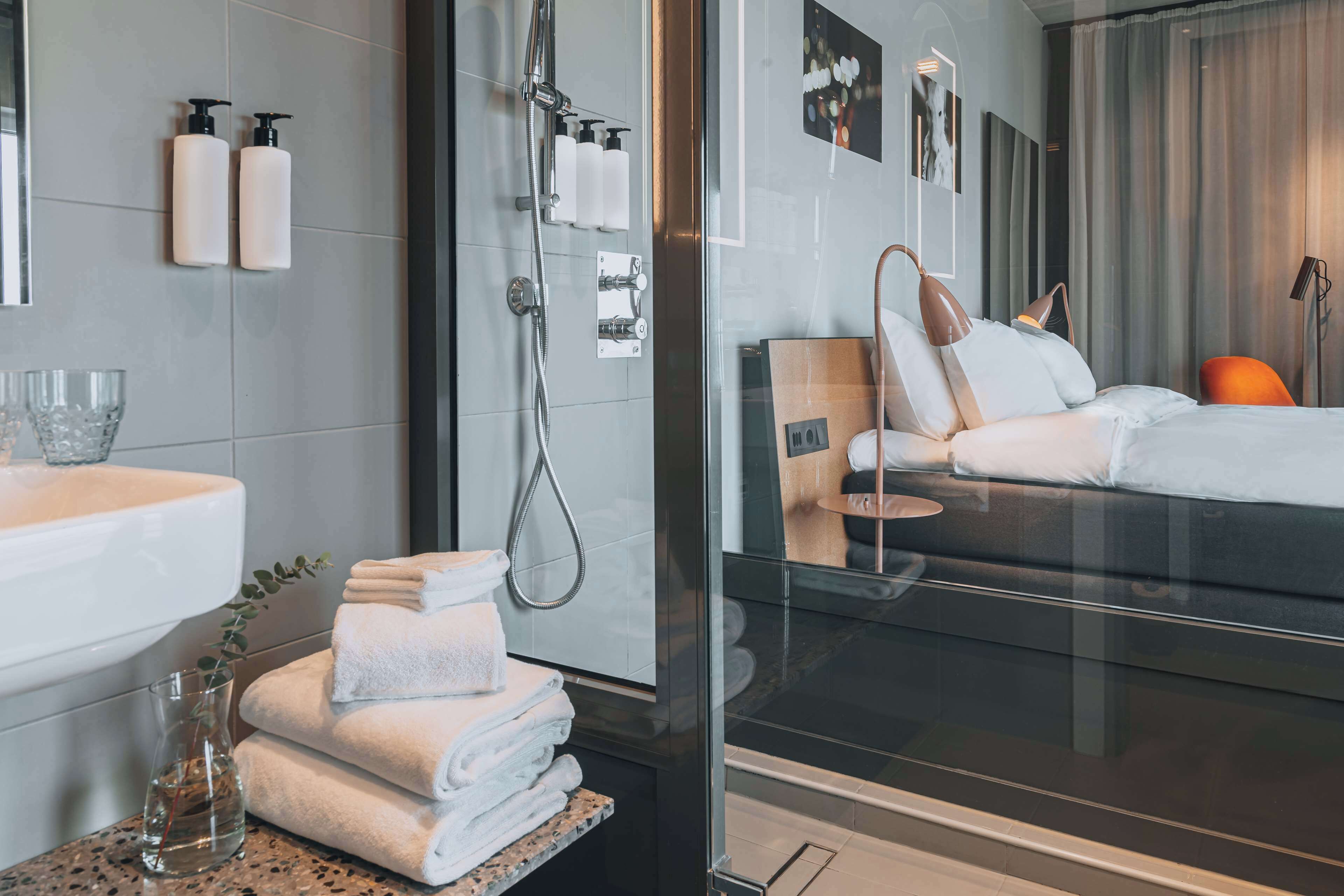 deluxe room, 1 king bed, ocean view | bathroom | designer toiletries, hair dryer, towels