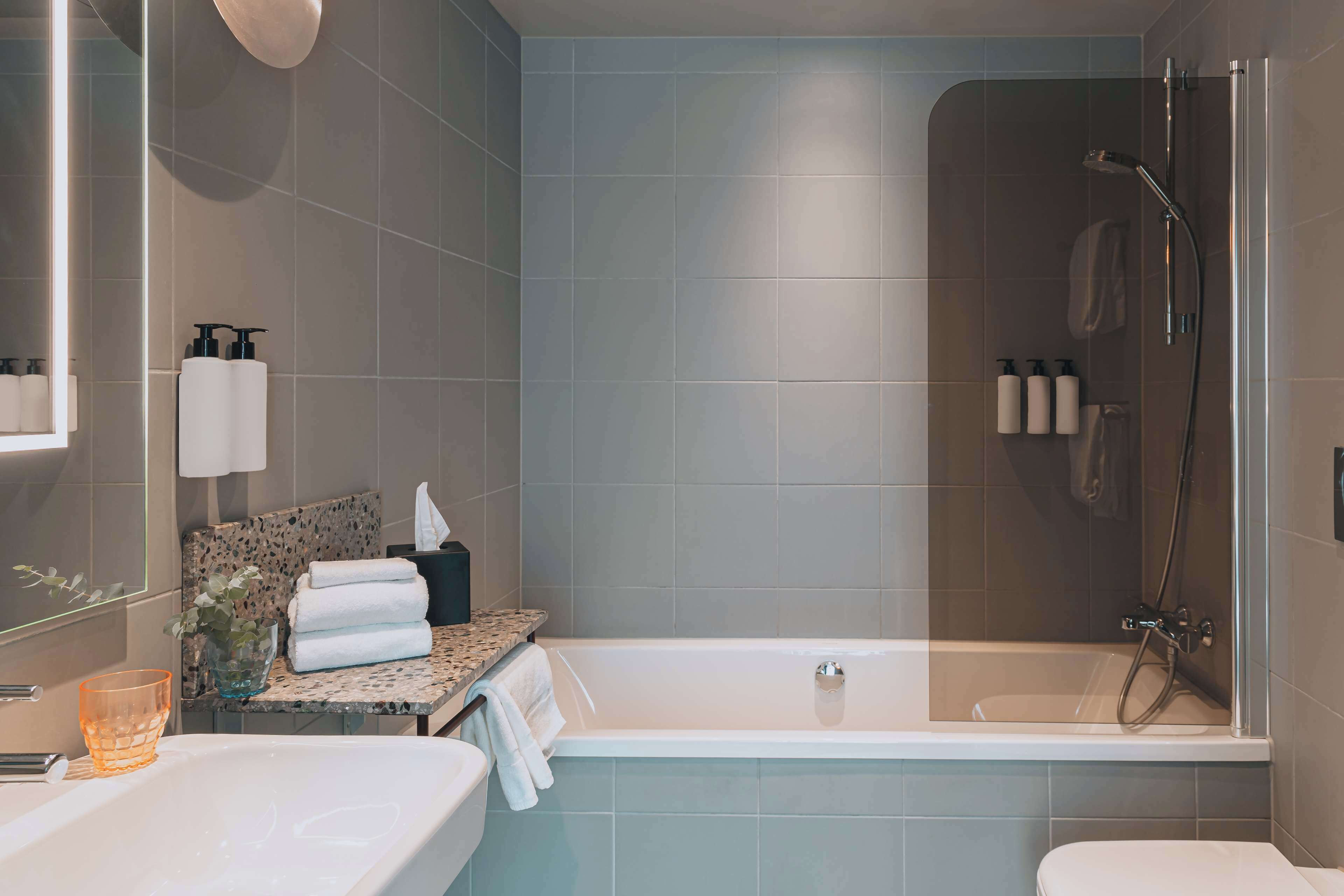 junior suite, 1 king bed, ocean view | bathroom | designer toiletries, hair dryer, towels