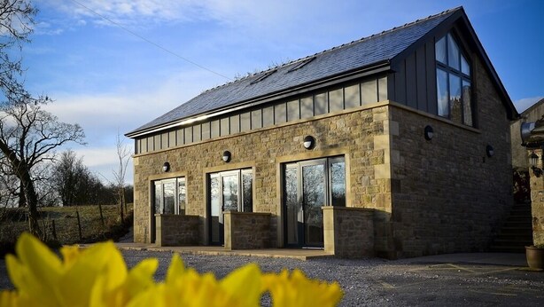 A modern building with a stone facade, large windows, and a sloped roof. - The 3 Millstones Inn (Clitheroe)