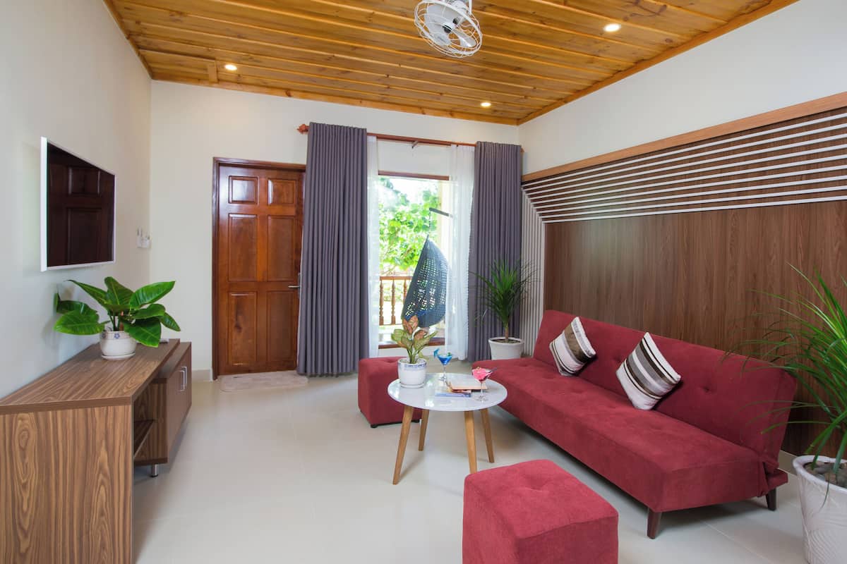 family villa | living area | 40-inch flat-screen tv with cable channels, tv
