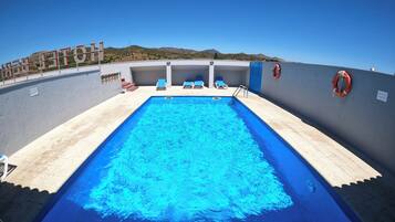 Seasonal outdoor pool, open 10:00 AM to 9:00 PM, sun loungers
