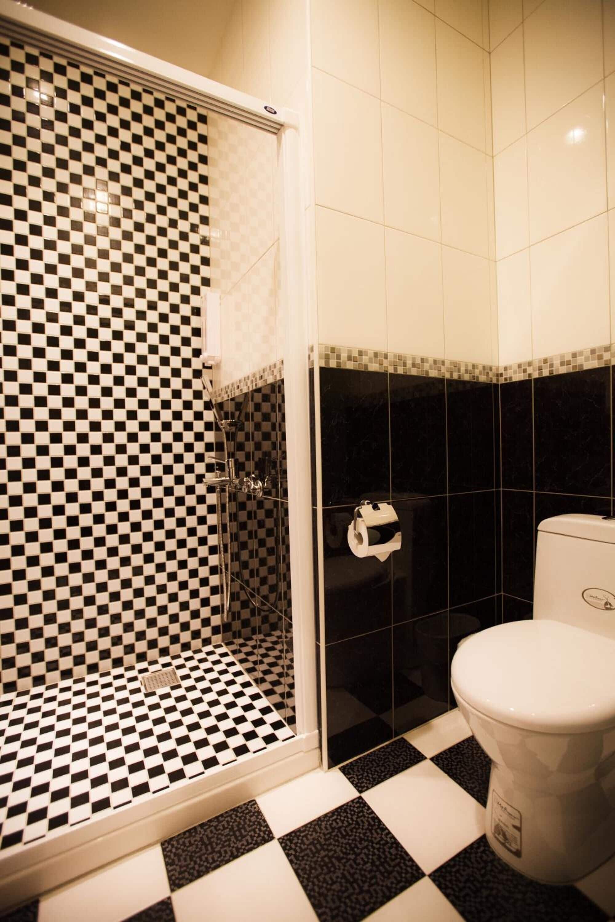 shower, hair dryer, slippers, towels