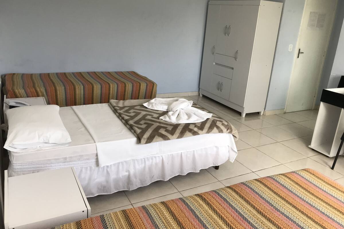 Standard Quadruple Room | Minibar, desk, blackout curtains, rollaway beds