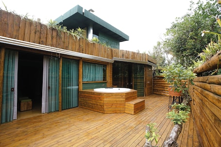 Family Cabin | Living area | 20-inch TV with satellite channels. Grajagan Surf Resort