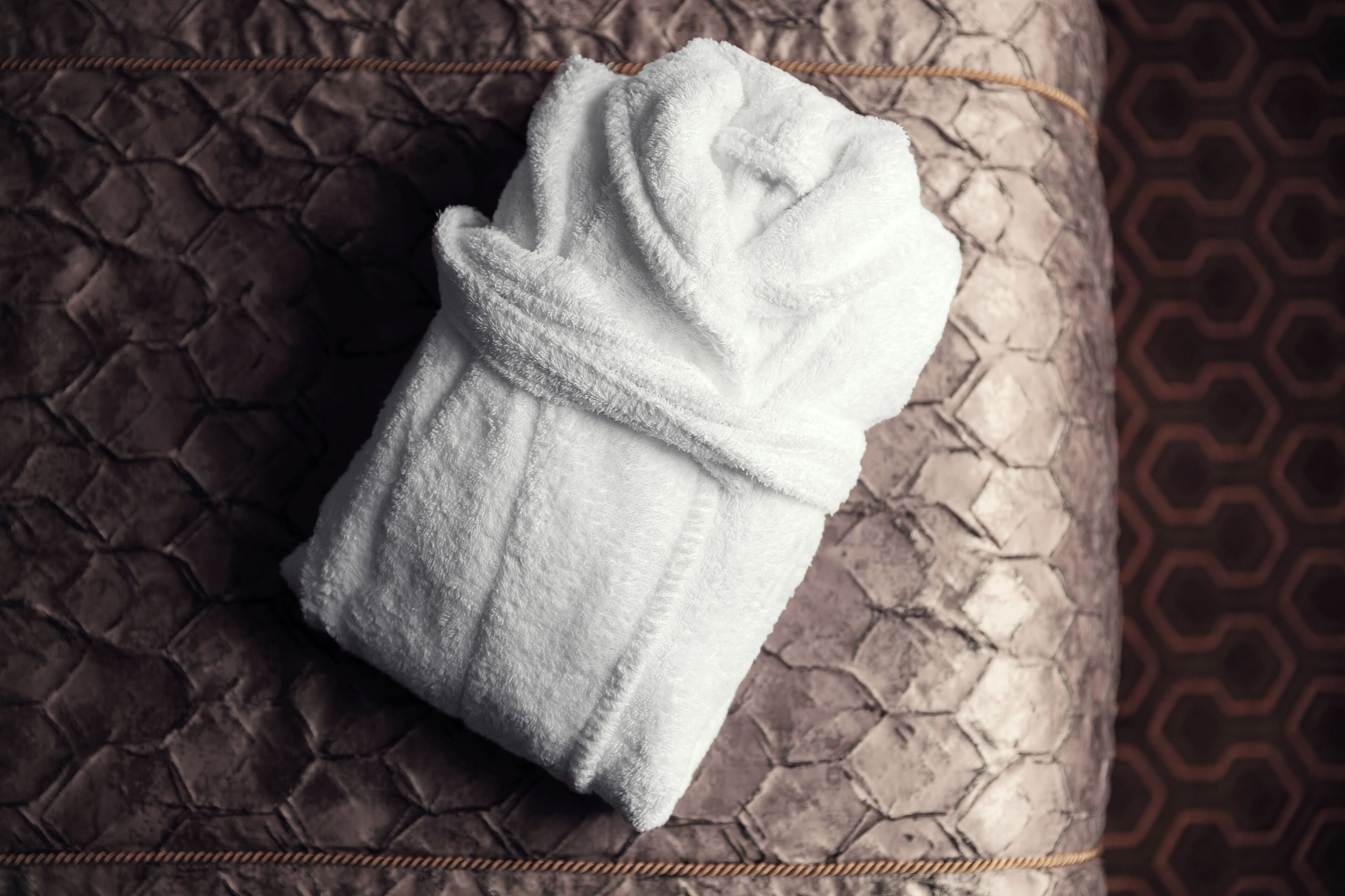 designer toiletries, hair dryer, bathrobes, slippers