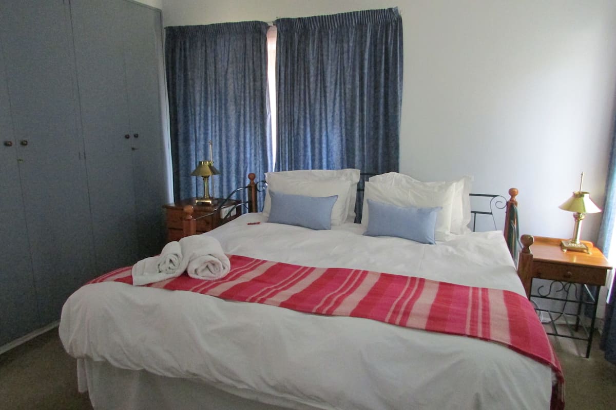 Standard House, 1 Bedroom (Acacia House) | 1 bedroom, in-room safe, desk, iron/ironing board