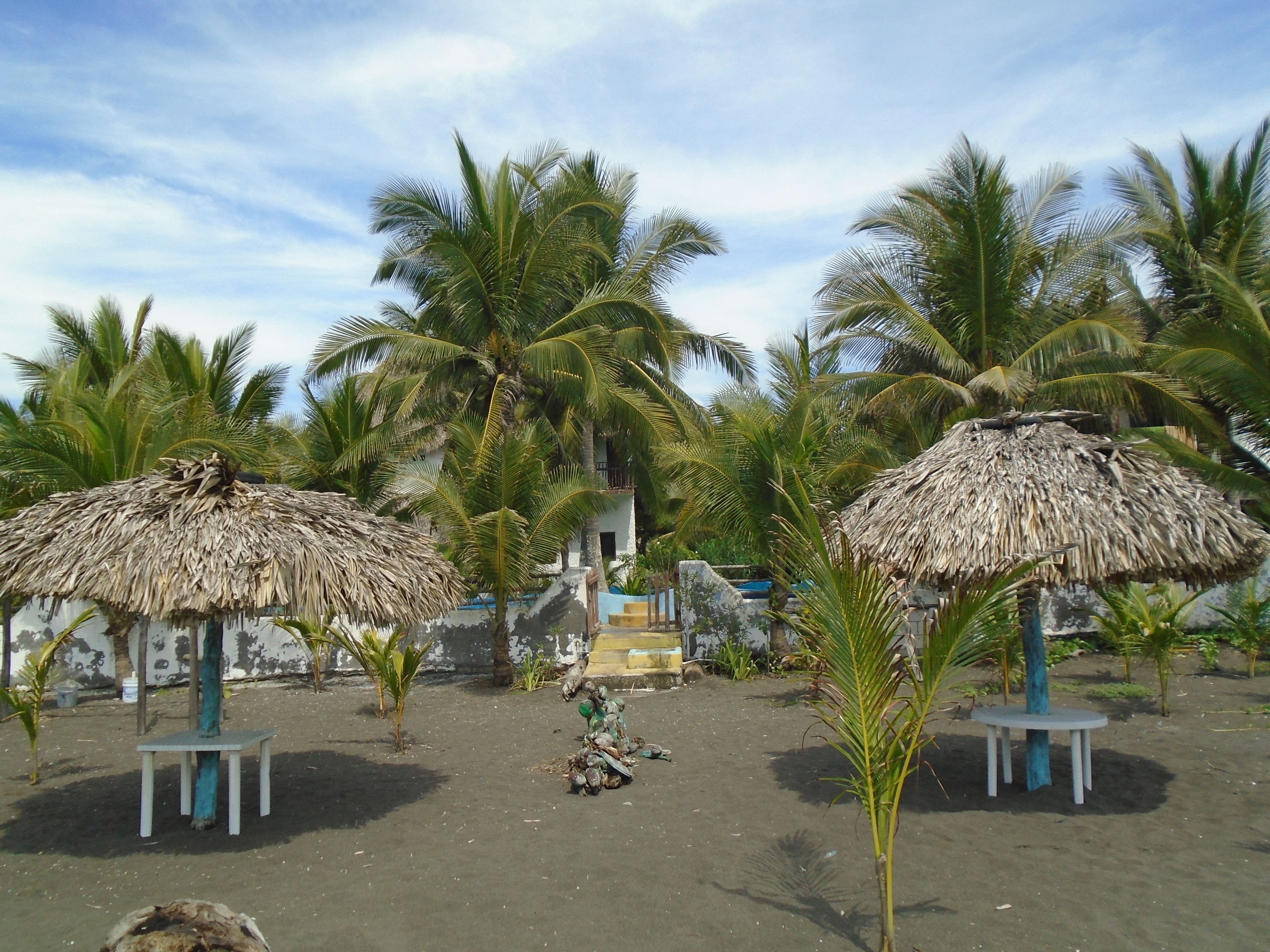 Private beach, black sand, free beach cabanas, sun loungers