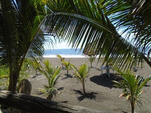 Private beach, black sand, free beach cabanas, sun-loungers
