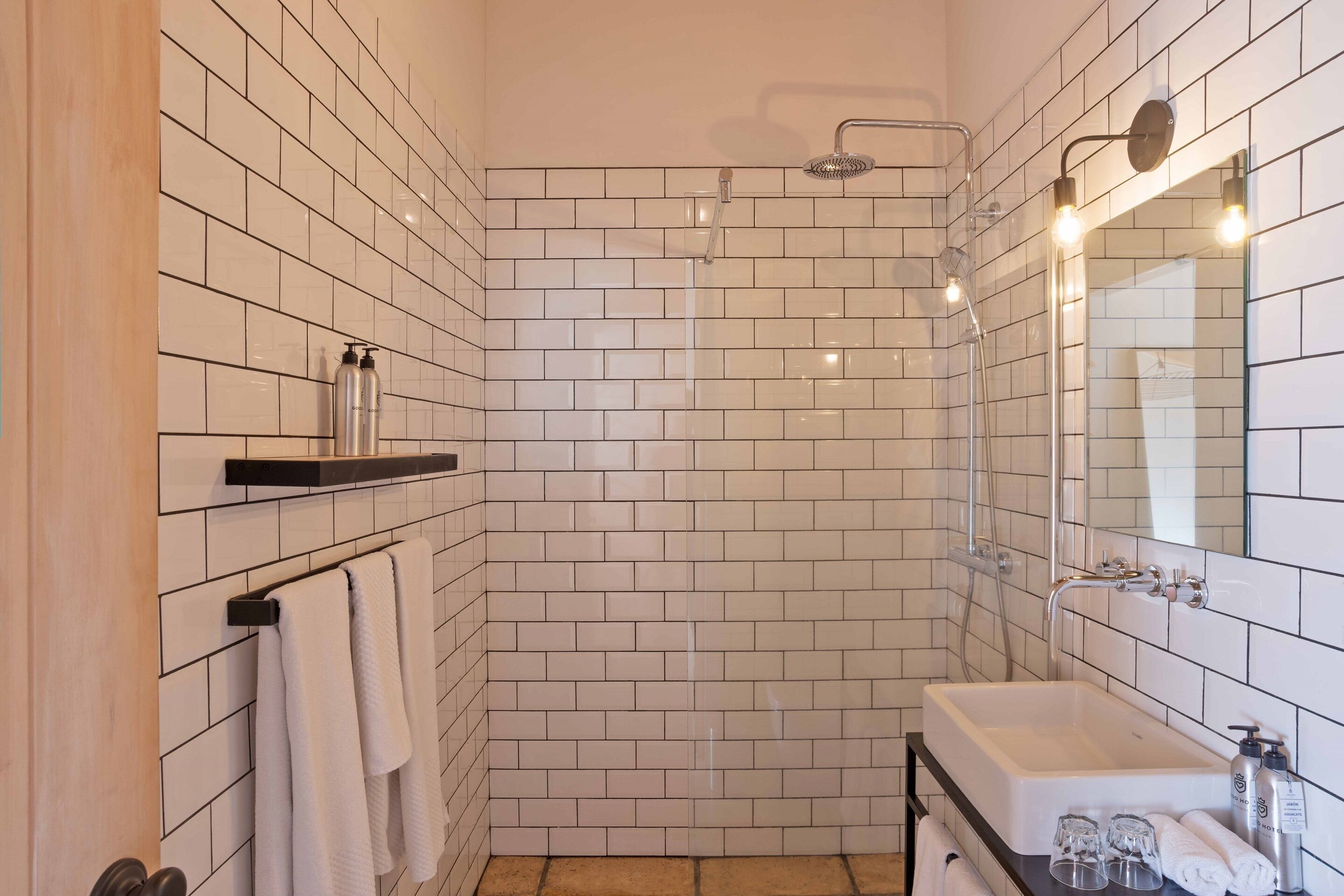 rainfall showerhead, designer toiletries, hair dryer, towels