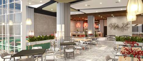 A spacious indoor area with multiple tables and chairs, a reception desk, and decorative plants.