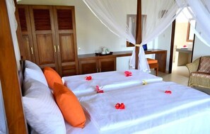 Habitación Deluxe | Ropa de cama de alta calidad y minibar 