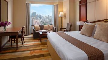 Rachada Suite | Minibar, in-room safe, individually decorated, desk