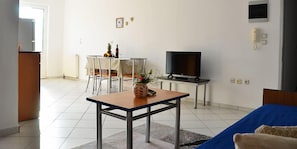Deluxe Apartment, 1 Bedroom, Garden Area | Living area | 32-inch flat-screen TV with satellite channels, TV - Pantheon Deluxe Apartments (Rhodes)