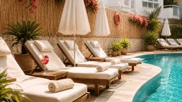 Outdoor pool, open 8:30 AM to 7:30 PM, pool umbrellas, pool loungers
