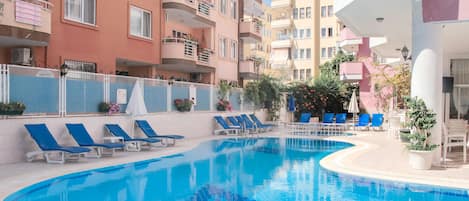 Outdoor pool, open 8:30 AM to 7:30 PM, pool umbrellas, pool loungers