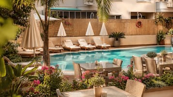 Outdoor pool, open 8:30 AM to 7:30 PM, pool umbrellas, pool loungers