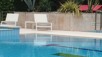 Outdoor pool, pool umbrellas, sun loungers