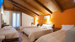 A hotel room with three beds, wooden beams on the ceiling, and two bedside lamps. - Pan Hotel (Delphi)