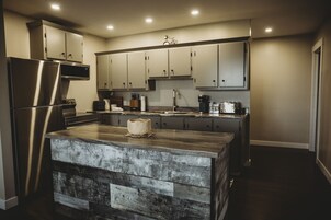 Apartment, Private Bathroom (Riverside Suites) | Private kitchen | Coffee/tea maker, fridge, microwave, electric kettle