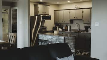 Apartment, Private Bathroom (Riverside Suites) | Private kitchen | Fridge, microwave, coffee/tea maker, electric kettle