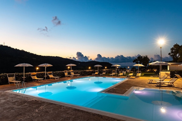 Seasonal outdoor pool, open 9:00 AM to 6:00 PM, pool umbrellas