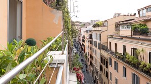 Stroll through historic city streets lined with charming balconies and traditional architecture.