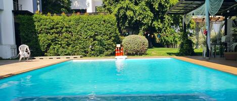 Outdoor pool, pool umbrellas, pool loungers