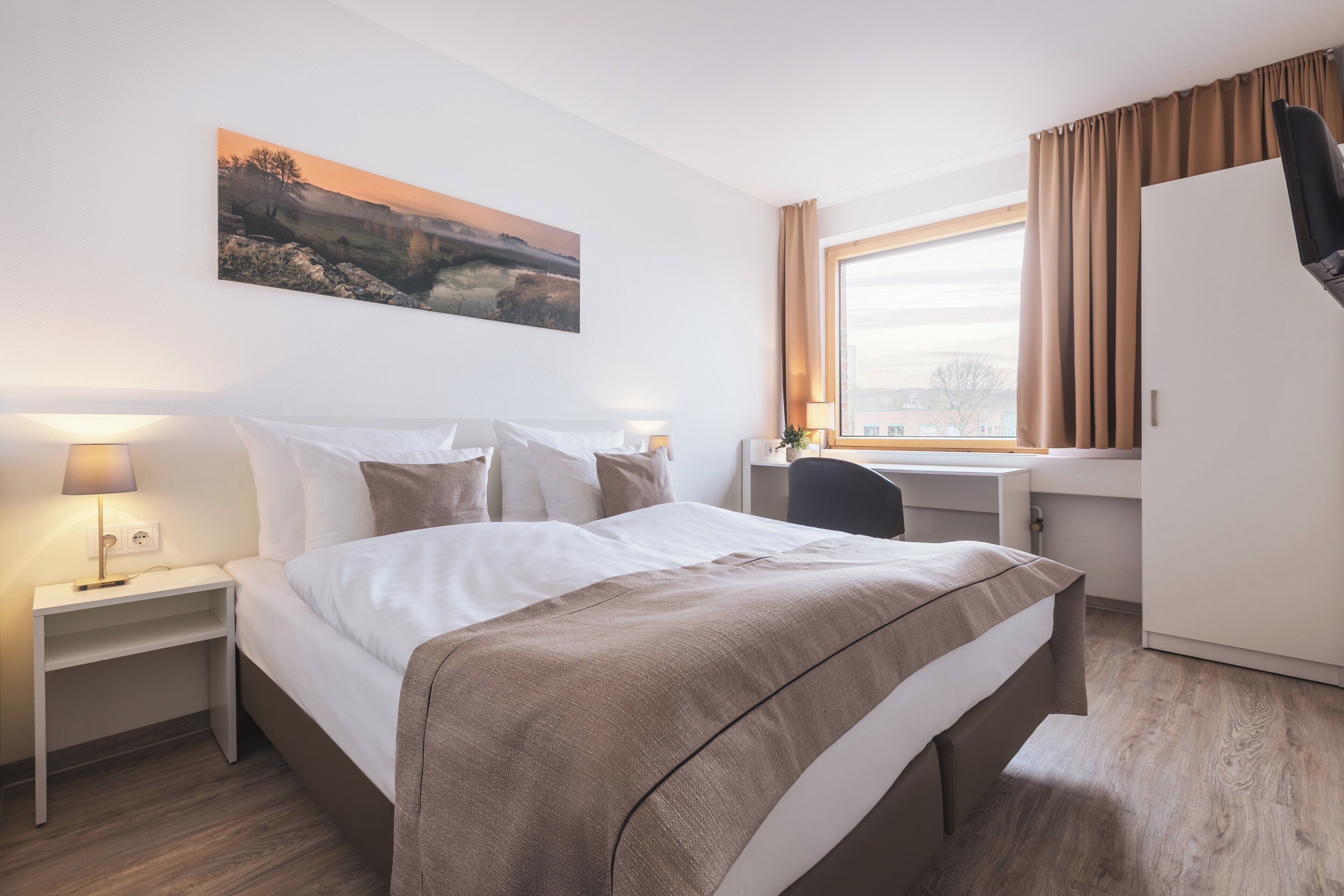 Hypo-allergenic bedding available, in-room safe, desk, laptop workspace