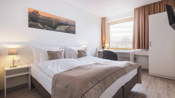 Hypo-allergenic bedding, in-room safe, desk, laptop workspace