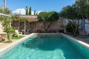 Seasonal outdoor pool, pool umbrellas, pool loungers
