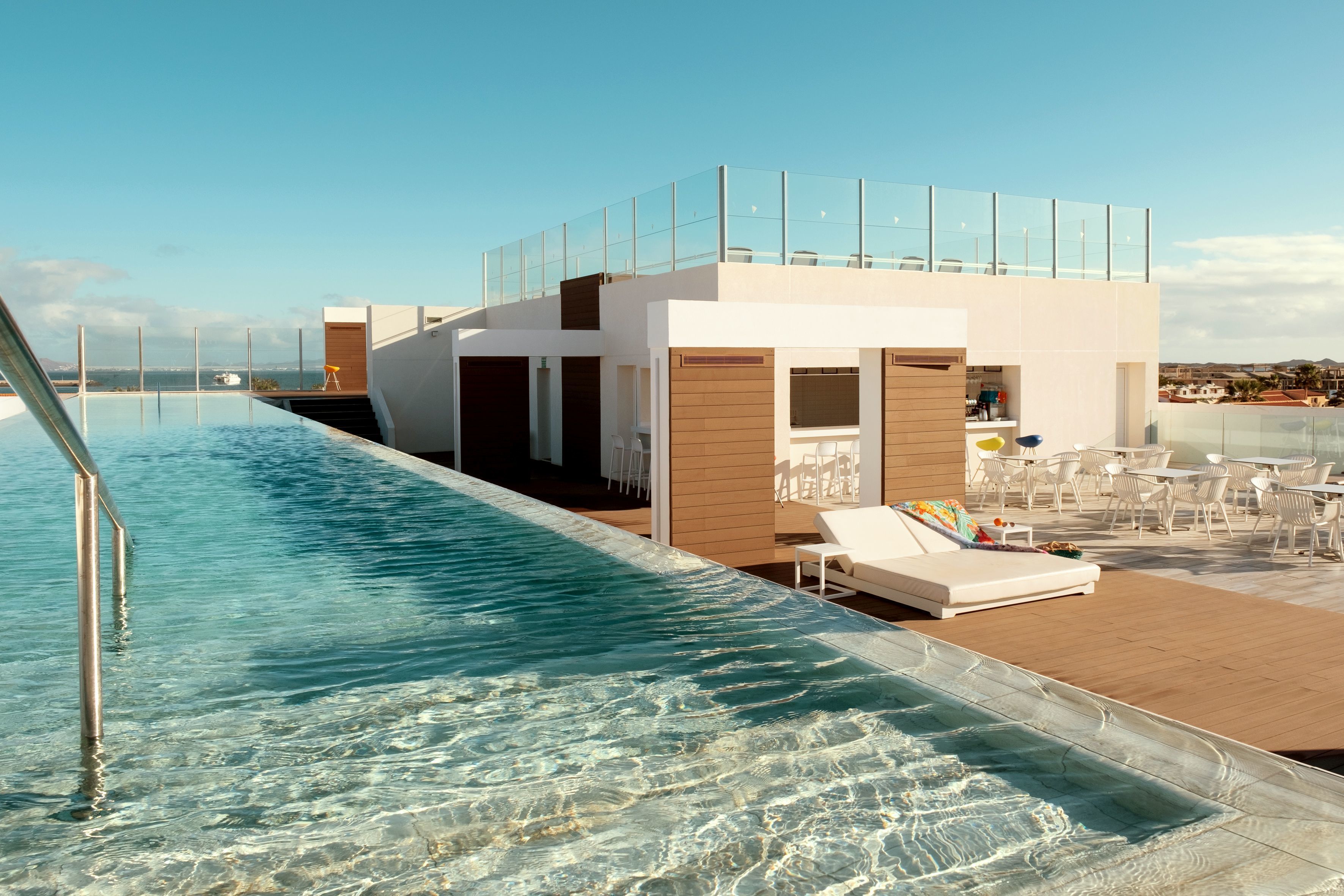 Outdoor pool, an infinity pool, sun loungers