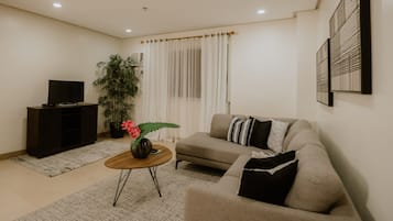 Premier Suite, 2 Bedrooms | Living area | 43-inch flat-screen TV with digital channels