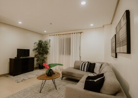 Premier Suite, 2 Bedrooms | Living area | 43-inch flat-screen TV with digital channels