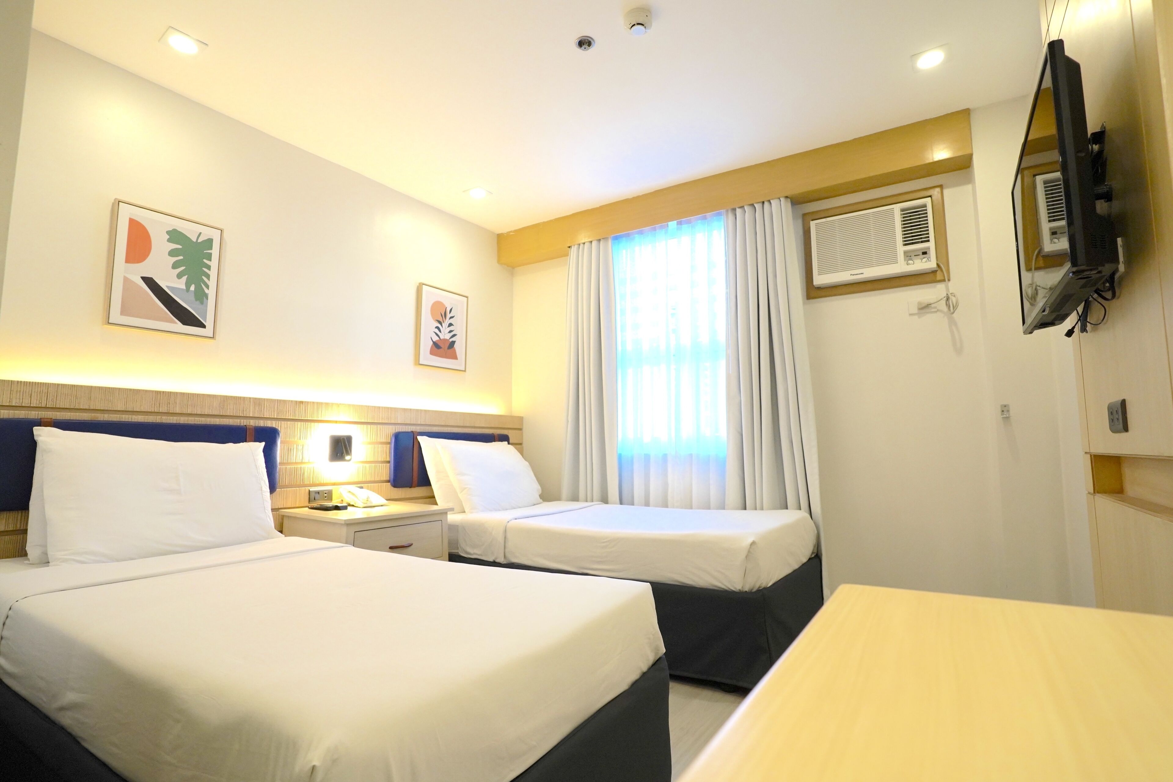 Habitación Deluxe con 2 camas individuales | Wifi gratis y ropa de cama 
