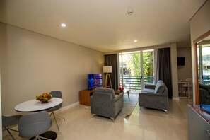 Premier Suite | Living area | 40-inch flat-screen TV with cable channels, TV