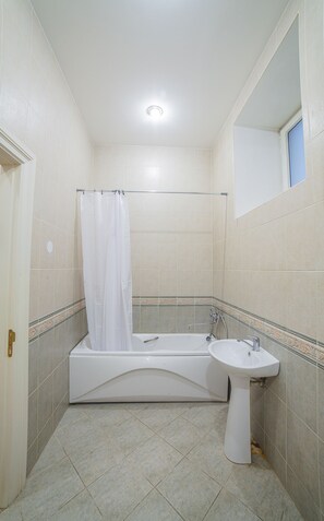 Standard Apartment | Bathroom | Hair dryer, towels, soap, toilet paper