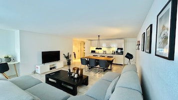 Apartment, 1 Bedroom | Living area | Flat-screen TV