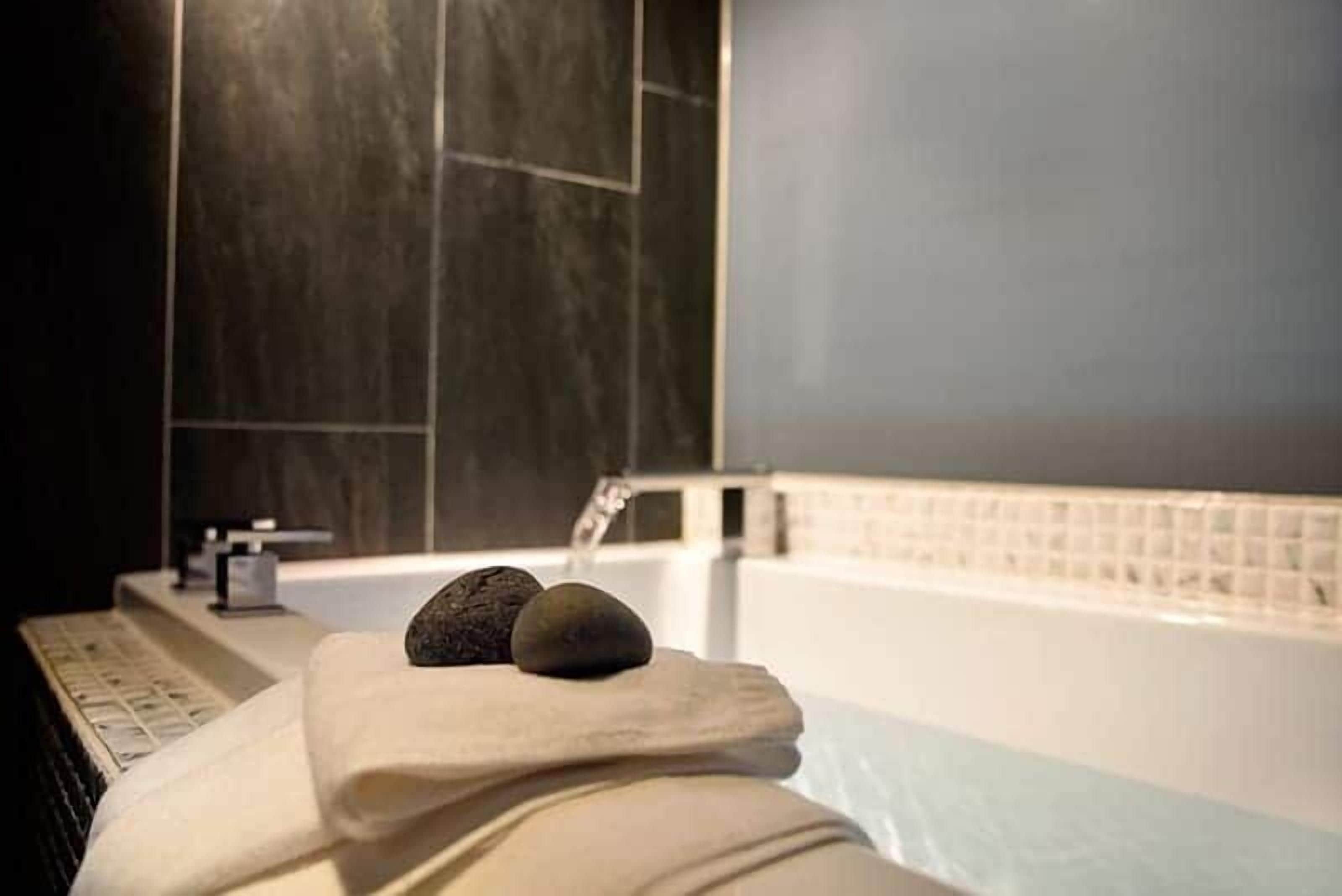 hair dryer, slippers, towels, shampoo