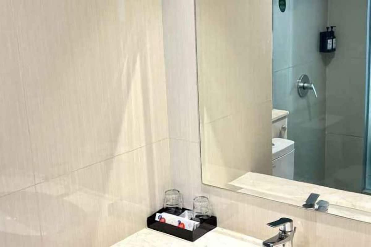 Shower, free toiletries, slippers, towels