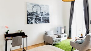 Design Apartment, 1 Bedroom, Patio, Garden Area | Living area | 50-inch flat-screen TV with cable channels, TV, offices - Boutique Apartments Vienna (Vienna)