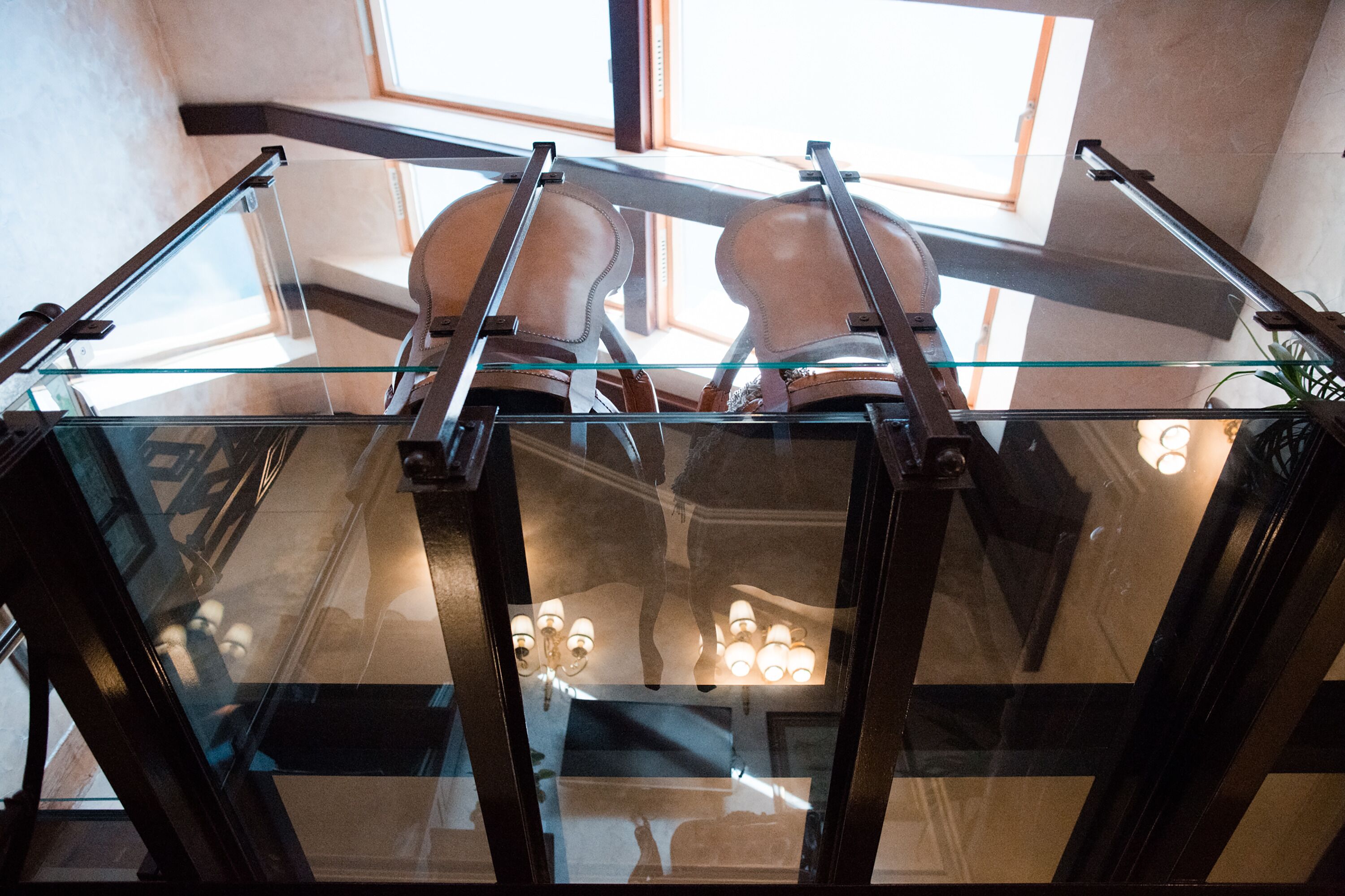 A modern interior with a glass ceiling and a view of the sky.