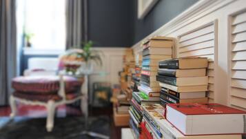 Relax in a peaceful reading nook with a comfortable chair and a collection of books.