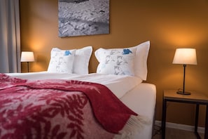 Hypo-allergenic bedding, desk, laptop workspace, blackout curtains