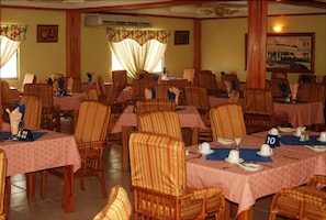 Breakfast, lunch, dinner served; Caribbean cuisine, pool views