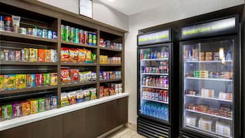 A vending area with snack and drink options, including a Bright Side Market sign.