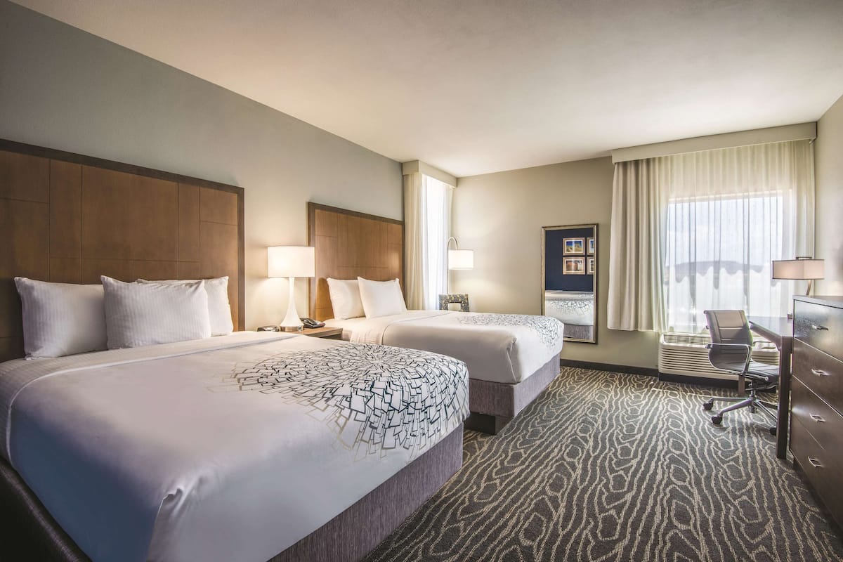 deluxe room, 2 queen beds, non smoking (family, various views) | premium bedding, desk, iron/ironing board, free cots/infant beds